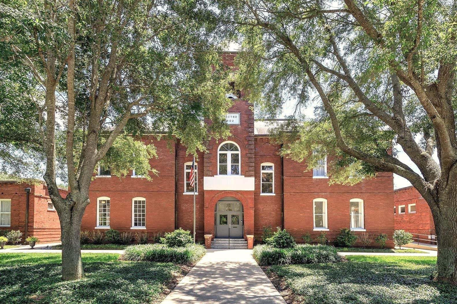 Venue 1902's historic brick building and lawn