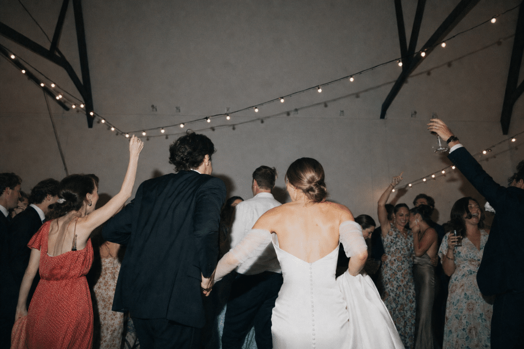 Wedding Venue Marketing Ideas: 20 Proven Ways to Promote Your Venue 8 Wedding reception in full swing inside an independent wedding venue, candid dance floor moment, the kind of celebration a packed booking calendar produces