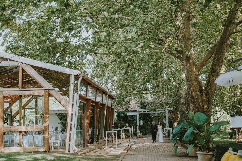 Open-air garden wedding venue near Sofia, Bulgaria — glass pavilion under mature trees